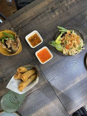 Pork skewers, spring rolls, & papaya salad