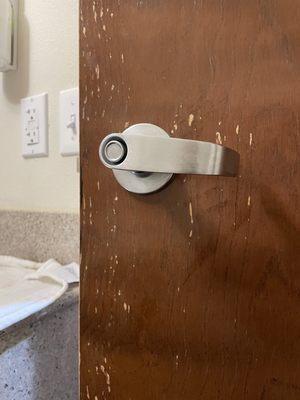 Motel owner too cheap to replace door.