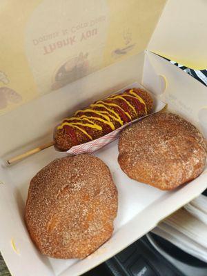 Mozza mix corn dog with mustard/ketchup, one cinnamon sugar Nutella donut and one cinnamon sugar strawberry cream cheese donut.