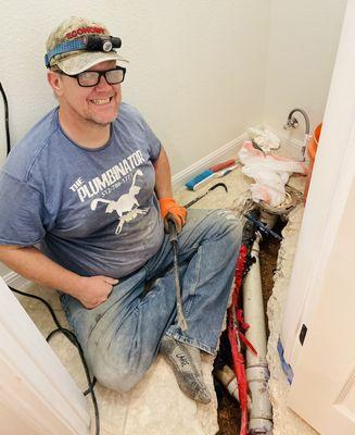 Steve is proud of the work he's done fixing this broken toilet line.