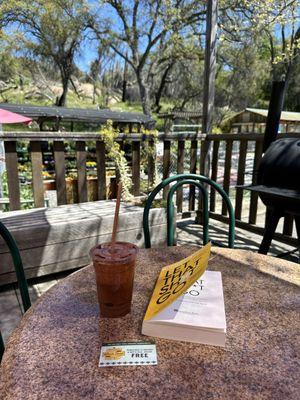 Enjoying a good book and a yummy chunky monkey smoothie.