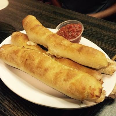 Bread sticks stuffed with bacon and refrigerator-cold marinara