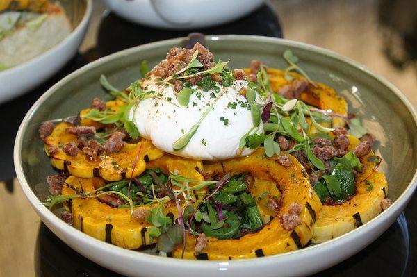 The Burrata was made with delicata squash, spiced local honey, and praline gremolata.