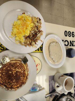 Cheese eggs pancake hashbrowns and chicken fried steak