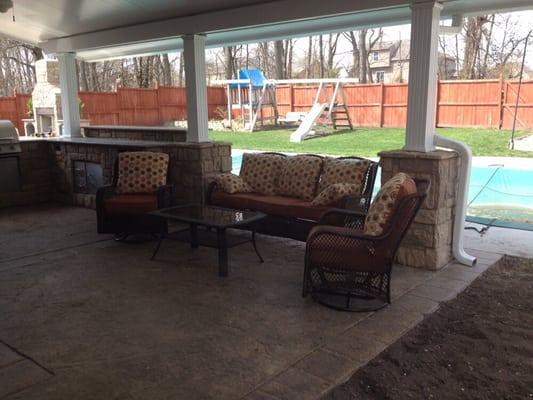 Outdoor living with kitchen and patio cover.