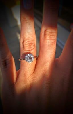 Fiancée's engagement ring with her grandmother's stone in center.