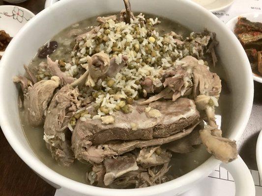 Duck soup with green rice.