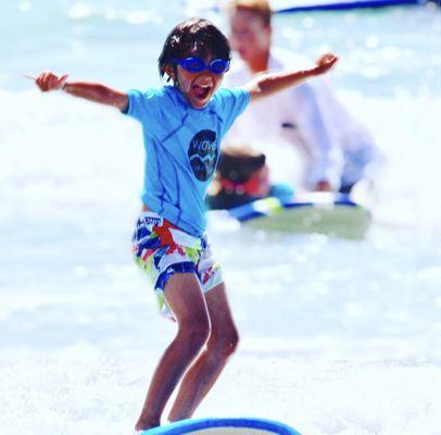 Just a kid catching his first wave!