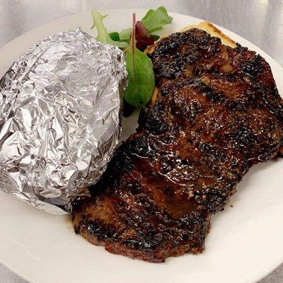 Our Ribeye served with a Baked Potato!