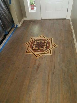 Refinished and stained maple floor.