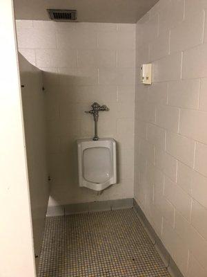 Staff bathroom looks..."worn but functional."