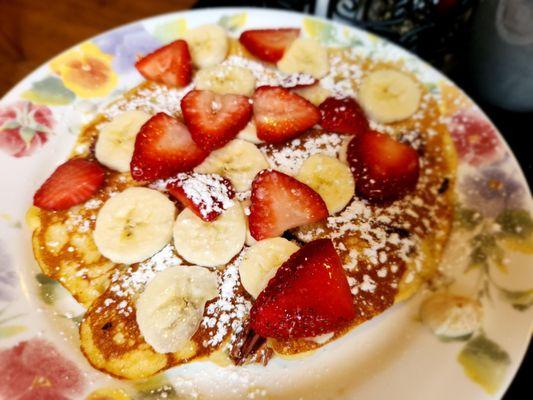 Pecan pancake with strawberries and bananas