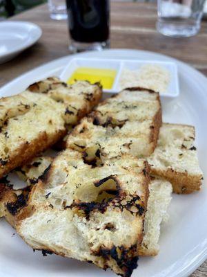 Grilled focaccia with olive oil.  Tasty & fresh.  Some of our entrees came with bread so may not be necessary to order separately.