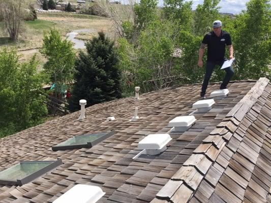 Identifiying damage. We replaced this old cedar roof with a architectural asphalt roof that has less fire hazards and lasts much longer.