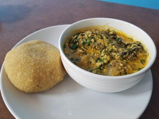 Egusi Soup with Eba/Wheat/Pounded Yam comes with Goat meat.