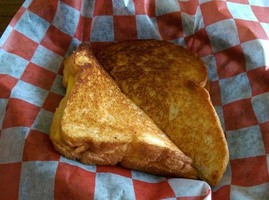 My grilled cheese sandwich when it was brought to me. Grilled perfectly but very plain.