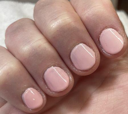 Jagged nail edges, poorly shaped, bad layered topcoat at awkward thickness.