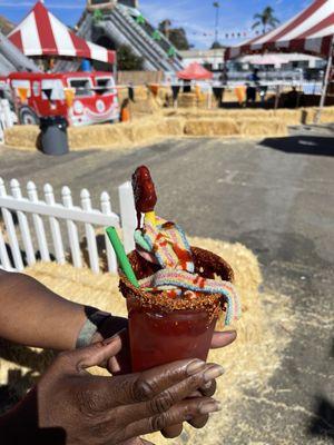 Agua Fresca watermelon flavored with Taheen and Chamoy with sweet and sour candy