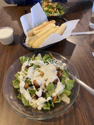 Side salad with ranch, breadsticks with ranch