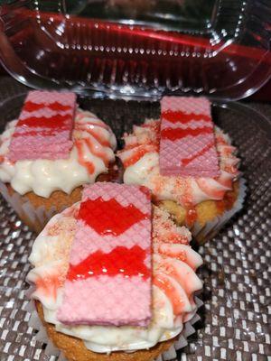 Vanilla cupcakes with strawberry wafers and butter cream