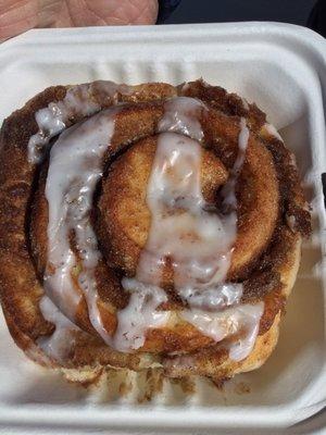 Delicious hot fresh baked cinnamon roll.