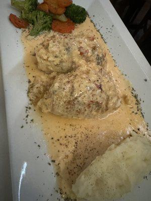 Crab-stuffed sole with shrimp Newburg sauce.