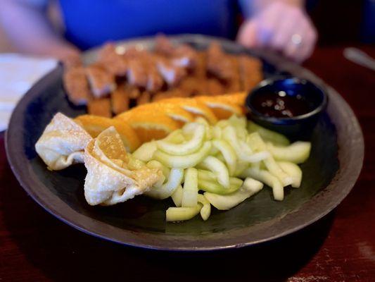 Pork Katsu comes w/cucumber salad, fresh Oranges & 2 crab rangoons! Love this dinner combo :)'