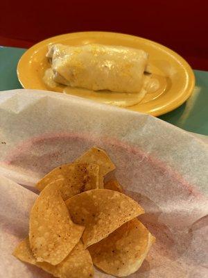 Brisket burrito smothered with queso