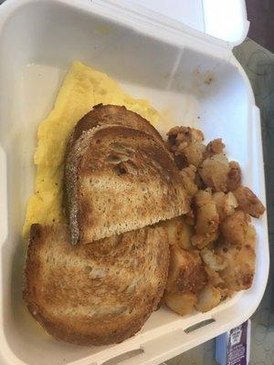 Scrambled eggs platter with home fries and rye toast