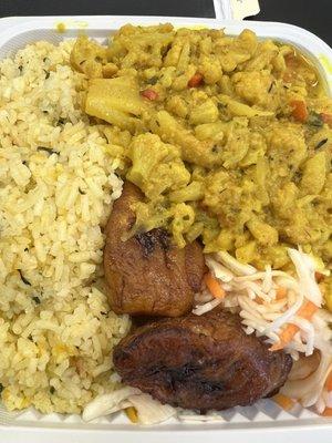 Curried cauliflower with pumpkin rice, fried plantain and coleslaw.