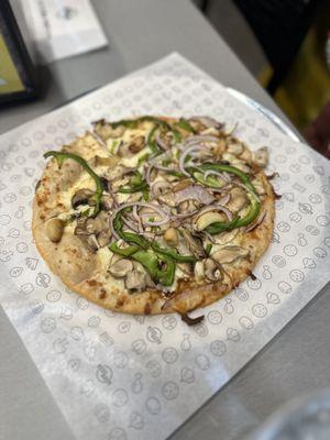 Chicken crust pizza with various veggies