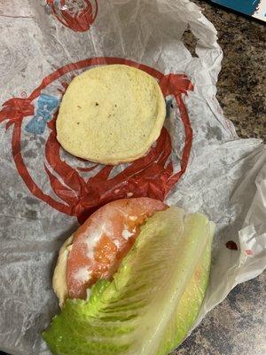 Burger in the wrapper upside down