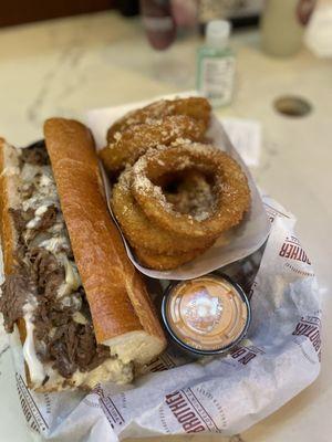 Cheesesteak and garlic Parm onion rings(didn't want fries so we put seasonings on onion rings instead)