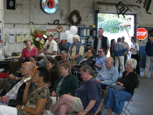 Party-goers at the Model Garage's 25th Anniversary celebration