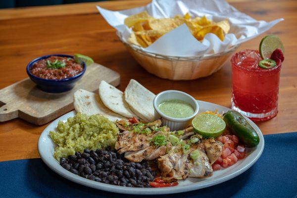 Chicken Fajita platter with strawberry jalepeno margarita!