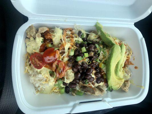 The Yummy Bowl: rice, cheese, teriyaki chicken, yummy sauce, avocado, black beans, green  onions, cherry tomatoes, and cilantro.