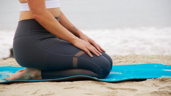 Be Peaceful. Yoga at the beach with a BACH instructor.