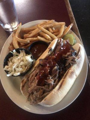 BBQ pulled pork po boy sandwich with fries and slaw