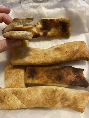 Burnt and ice cold "breadsticks" which were unedible