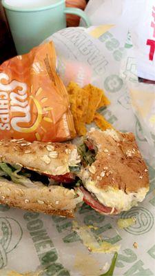 Chicken salad sandwich and cheddar cheese chips.