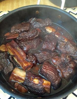 Beef short ribs slow braised with garlic and red wine.