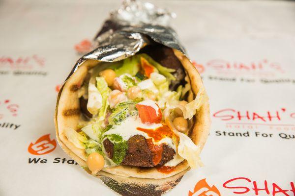 Falafel on a pita bread with your choice of salad and sauces.