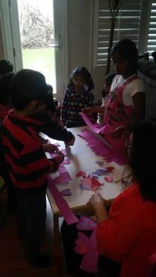 The kids making Valentines Day decorations.