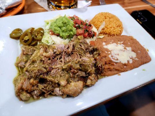 Carnitas with green sauce, rice and beans