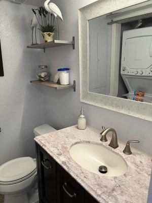 Half bathroom and washer dryer