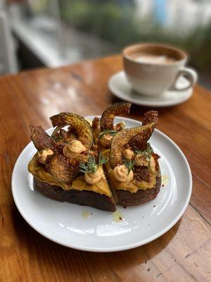 Fall on toast: Squash purée, harissa mascarpone, candied walnuts & crispy squash chips. Cozy, crunchy perfection.  #BrunchGoals