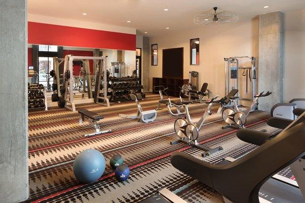 Fully equipped fitness center with cardio and weight equipment