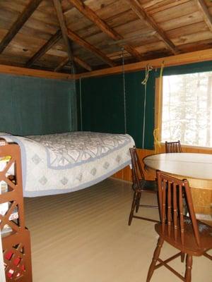 Porch with swinging bed in Wildflower.