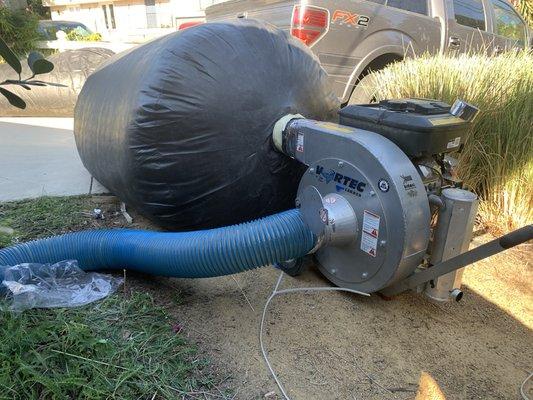 Attic insulation vacuum