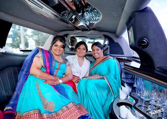 Bridal party in one of our limos.  Photo courtesy of Hakim's Studio.